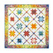 Colorful quilt with diamonds all over with traditional style sawtooth stars made with floral fabrics from the Wild Blossoms collection isolated on a white background