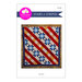 Front of the Stars n Stripes pattern with an image of the finished red, white, blue, and yellow quilt draped over a fence