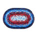 Isolated image of a red, white, and blue Jelly Roll Rug made up of concentric fabric strips.