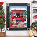 Photo of a finished panel quilt featuring golden retriever puppies in front of a red truck in a snowy Christmas scene hanging on a white paneled wall with a Christmas tree on one side and matching decor on a white shelf on the other