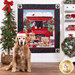 Photo of a finished panel quilt featuring golden retriever puppies in front of a red truck in a snowy Christmas scene hanging on a white paneled wall with a Christmas tree on one side and matching decor on a white shelf on the other with a golden retriever wearing a Santa hat in the foreground