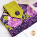 Close up of hanging towel detail for May, featuring bold purple and bright green floral fabrics.