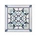 Photo of finished geometric and floral quilt made with green, light blue, navy and cream fabrics isolated on a white background