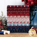 Deep red, white, and navy fabrics stacked on a wood table surrounded by flowers and thread