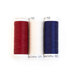 Photo of red, white, and blue thread spools isolated on a white background