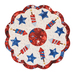 A patriotic red, white, and blue scalloped table topper with stars and fireworks on a white background