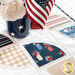 Close up of table runner detail showing stitching and fabric motifs with an American flag centerpiece