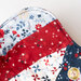 Close up of one edge of bowl cozy showing detail of patriotic fabrics from the Red, White and True collection