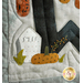 Close up of a small Halloween themed quilt applique motif of gravestone and pumpkin
