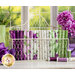 Plum, lavender, cream, and green floral fabrics in a wire basket