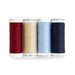 isolated image of red, cream, light blue, and navy thread spools on a white background