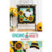 Photo of a finished wall hanging with a gnome wearing a bee costume with three large sunflowers, hanging on a metal craft hanger with a small ceramic beehive, a basket with spools of thread, and sunflowers in a metal canister on either side and in front of a white paneled wall with the words 