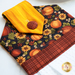 Close up of hanging towel for November, featuring pumpkins, sunflowers, and bright yellow textures with plaid accents on a white countertop