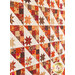 Close up, angled photo of blocks in autumn themed quilt made with Forest Frolic in a geometric pattern