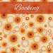 Cream fabric with abstract orange and yellow circles of varying sizes and an orange banner at the top that reads 