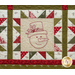 Close up of one quilt block showing fabric and stitching detail with an embroidered image of a snowman head wearing a top hat