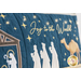 Close up photo of a large blue bench pillow embellished with decorative stitching in a nativity scene and the words 
