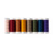 Photo of thread spools in a rainbow of colors isolated on a white background