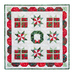 A Christmas themed quilt that features a wreath, wrapped gift boxes, and star motifs made with red, white, and green batiks isolated on a white background
