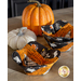Photo of two Halloween-themed bowl cozies made with the Hey Bootiful fabric collection on a table with pumpkin decor.