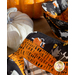 Close up photo of two Halloween-themed bowl cozies made with the Hey Bootiful fabric collection on a table with pumpkin decor.