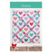 The front of the Heartsy quilt pattern by Cluck Cluck Sew featuring a lattice of geometric shapes with a heart at the center of each