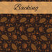 Fabric with vines, orange flowers and paisley leaves on a solid black background with a gold banner and the word 