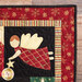 Close up of one corner of the border of the wall hanging featuring an angel figure holding a gold star