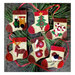 Photo of 6 mini stocking ornaments on a gray table top with pine tree boughs. Each stocking has a different motif including candy canes, mittens, and a train