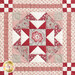 Close up photo of one block of the patchwork quilt made with red and cream floral fabrics