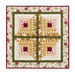 Photo of a floral log cabin wall hanging made with yellow, white, green, red and pink fabrics from the Evermore collection, isolated on a white background.