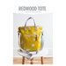 front cover of the Redwood Tote showing the completed bag atop a stool with a white wall in the background