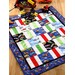 Small throw quilt featuring blue fabric with vehicles, as well as green, red, and white accent fabrics. 