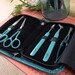 turquoise embroidery tool set in carrying case