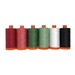 six colorful spools of thread in a Christmas theme