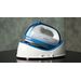 Cordless Steam Iron 360° Freestyle - Blue, staged on a table