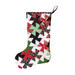 Photo of a Christmas stocking made with red, green, black, and white Christmas fabrics isolated on a white background