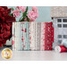 photo of my summer house fabric stacked next to a tin house and pink and red flowers