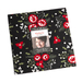 photo of starberry fabric squares, in shades of red, white, green, and black, on a white background