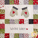 Close up of one block in the Hometown Christmas quilt featuring a pair of mittens and the words 