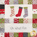 Close up of one block in the Hometown Christmas quilt featuring a row of 3 stockings and the words 