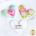 Three scattered patchwork pocket prayer hearts on a marble table