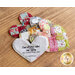 Five different assembled patchwork heart pocket prayer quilts on a wooden table