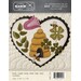 Front of March pattern, showing the finished heart staged on the wall hanging and featuring plants, bees, and a bee skep!