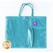 Image of the front of the teal tote, showing three vinyl pockets and one long cloth pocket