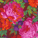 close up of Fabric featuring vibrant pink, orange, and red roses and deep purple grapes amidst vivid green leaves and a brick red background