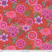 Fabric featuring vibrant pink, red, and purple flowers over a red and pink background with abstract green and maroon dots