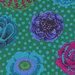 close up image of fabric that is vibrant teal, aqua, green, and magenta flowers over an aqua polka dotted teal fabric