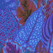 close up of Bright fabric with vibrant layered blue, purple, pink, and brown coleus leaves
