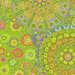 close up of Fabric featuring vibrant green, teal, orange, and pink kaleidoscopic abstract shapes